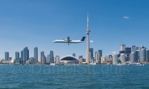 Plane flying into Toronto from the ferry to Toronto Island.