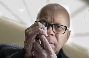 La Mine D'Or gemologist performs a diamond appraisal, a location, working headshot